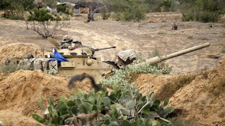Egyptian soldiers guard the Egypt-Gaza border