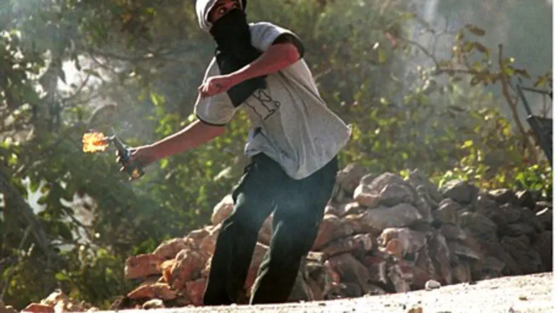 (Illustration) Arab rioter throws firebomb