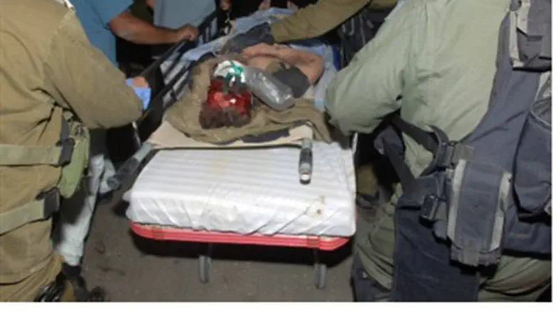 Wounded soldier wheeled into hospital, 31.10.