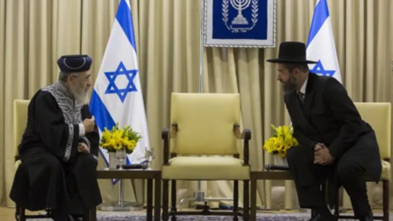 R' Yitzhak Yosef, left, and R' David Baruch L