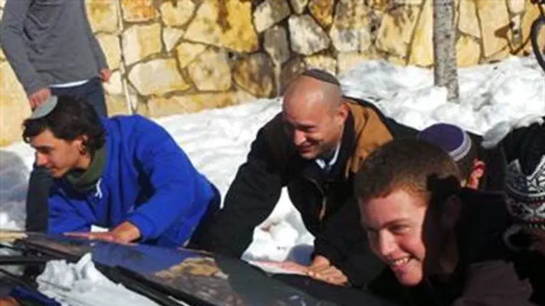 Bennett pushing a stuck car