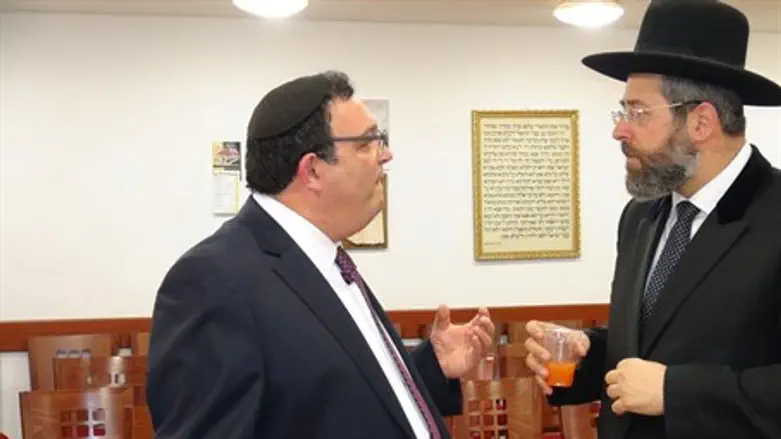 Rabbis David Lau (right) and Shai Piron