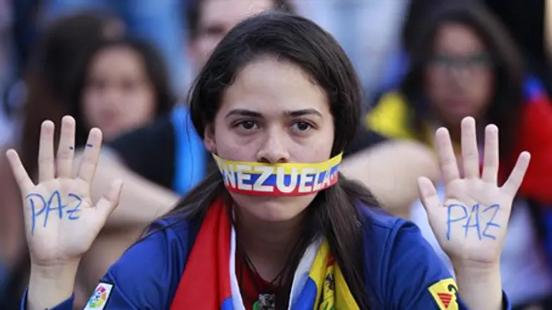 Venezuelan student at opposition rally in Car