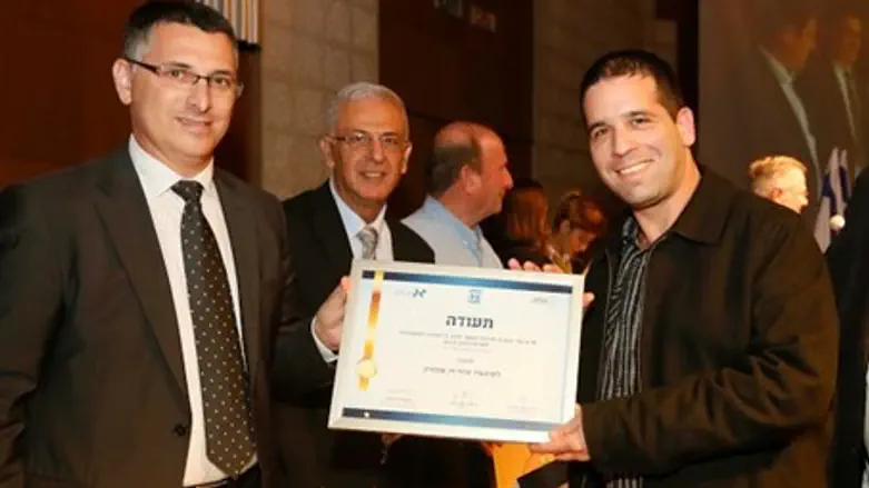 Interior Minister Gidon Sa'ar presenting the