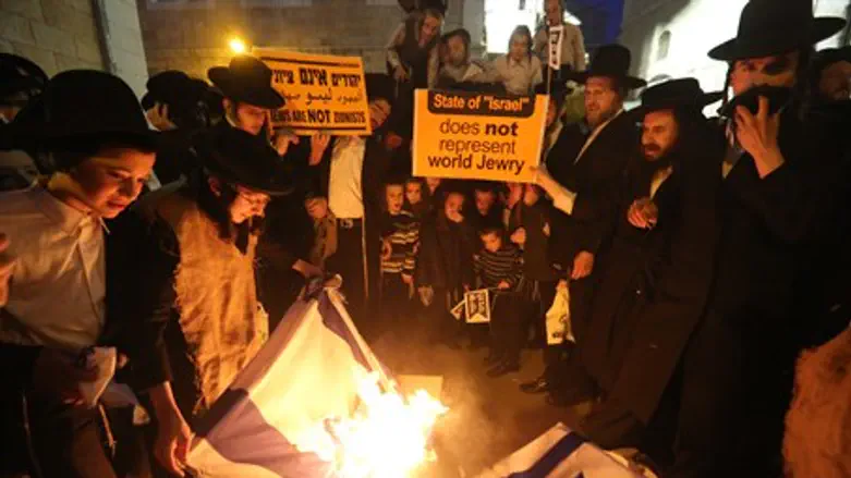 (Illustrative) Neturei Karta members burn an 