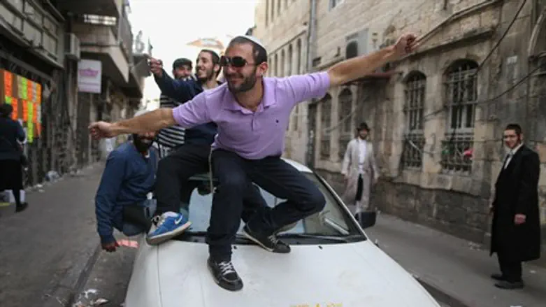 Purim revelers in Jerusalem's Meah Shearim ne