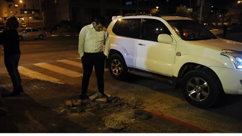 Israeli man inspects the site of Islamic Jiha