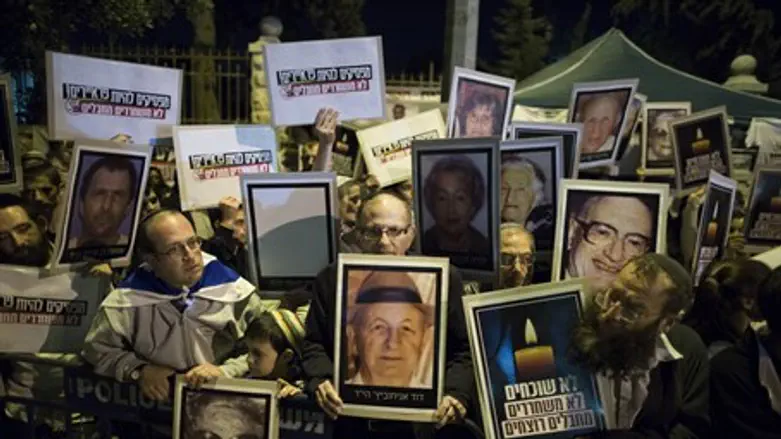 Families of victims of terrorism rally outsid