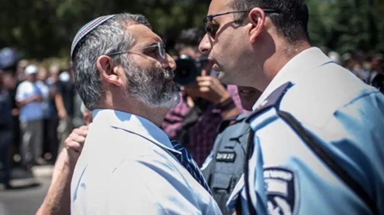 Michael Ben-Ari facing off with police (file)