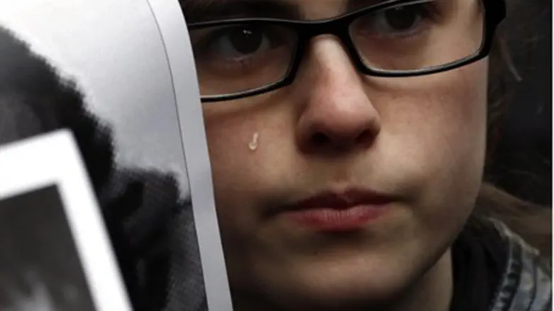 Relative of victim at AMIA protest (file)