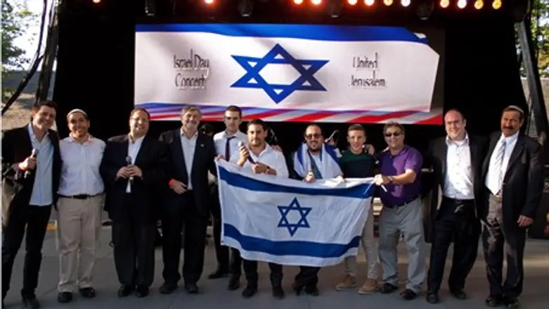 Artists and organizers on stage after the Isr