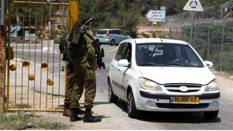 Israeli soldiers stand guard at the entrance 