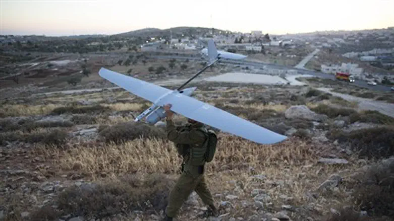 IDF soldier prepares to launch a drone as par