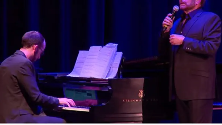 Dudu Fisher (R) sings "Bring Them Home" for k