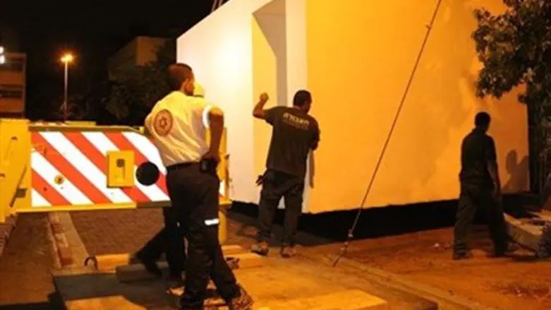 Shelter being lowered into place