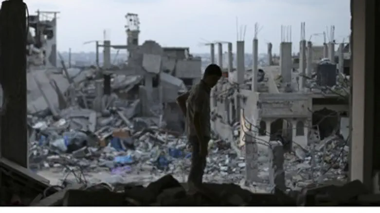 Gaza man in the ruins of his home.