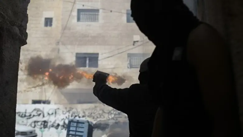 Arab rioters shoot firework in Jerusalem
