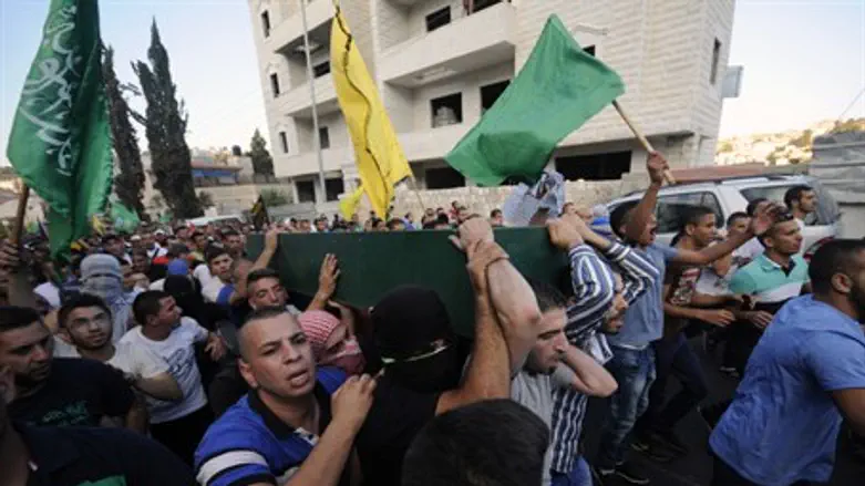 Hamas flags at Arab rioter's funeral in Jerusalem