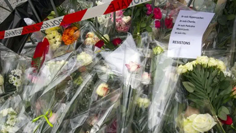 Flowers outside the Hyper Cacher kosher supermarket in eastern Paris