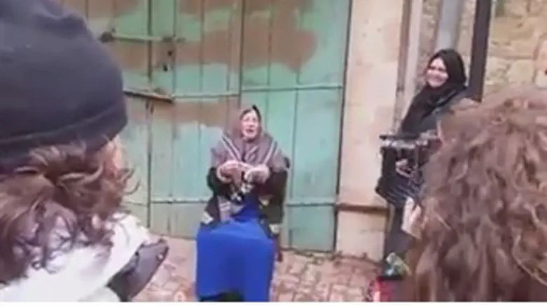 Hevron woman puts on a show for the cameras