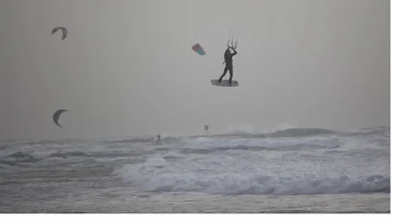 Windsurfers enjoy the storm