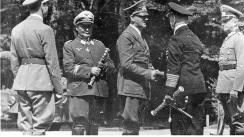 Hermann Goering (2nd L) with Adolf Hitler (C)
