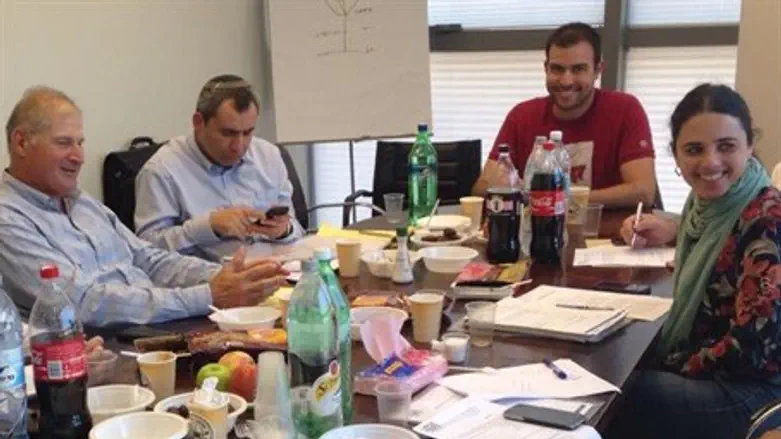 MK Shaked at negotiation table.