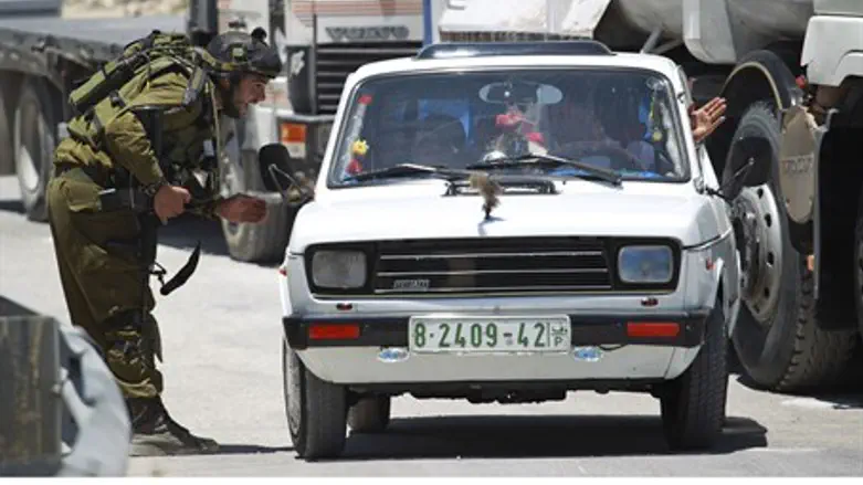 IDF soldier with PA car (file)