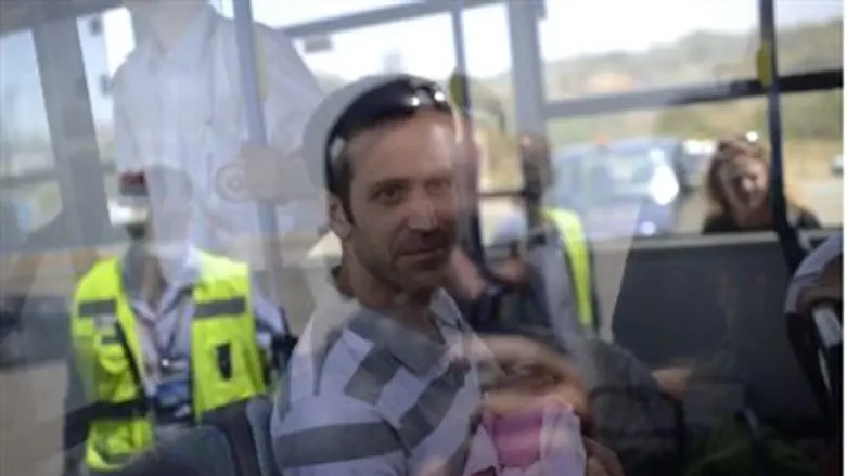 Parent with baby arrives at airport.