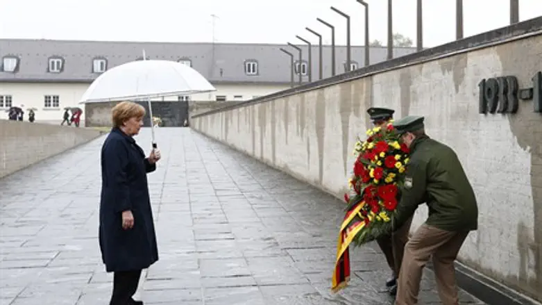 Chancellor Angela Merkel lays a wreath at the site of Dachau concentration camp