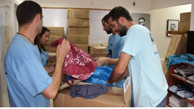 Students gather packages for refugees