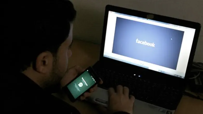 Arab in Gaza uses Facebook (illustration)