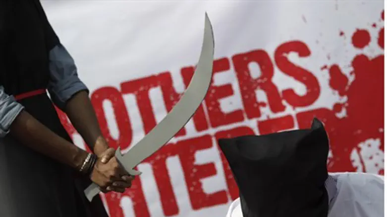 Bangladeshi activists stage mock execution in protest of Saudi beheadings (2011)