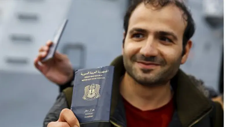 Syrian refugee holds passport (illustration)