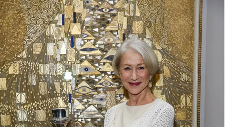 Helen Mirren in front of "Woman in Gold" painting