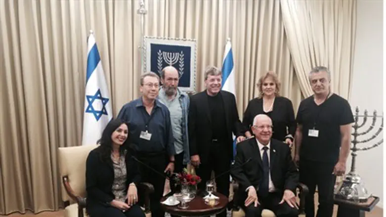 Miri Regev and Silvan Shalom (seated) meet with Israeli artists