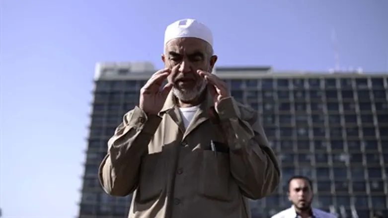 Sheikh Raed Salah prays in Tel Aviv's Rabin Square