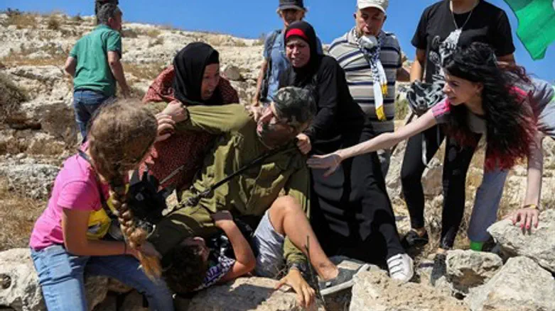Soldier mobbed at Nabi Salah.