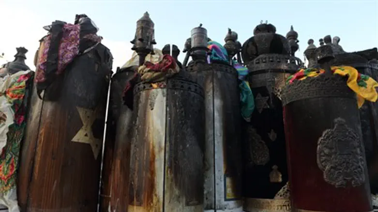 Torah scrolls burned in synagogue arson (illustration)