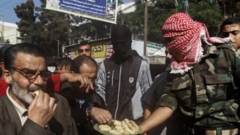 Arab terrorists hand out candy to celebrate attack (file)