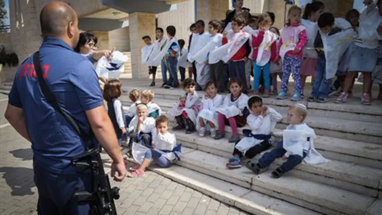 Security guard with children (file)