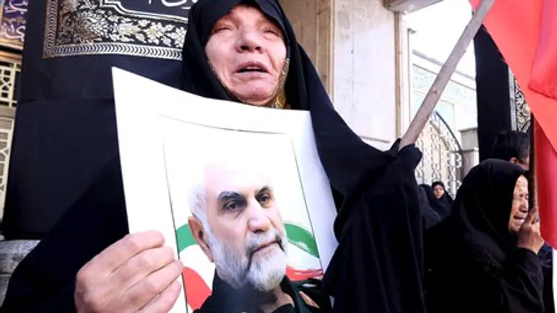 Mourner at funeral of slain Iranian general Hossein Hamedani