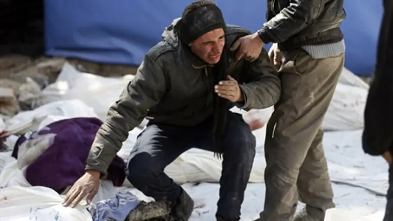 Syrian man cries over family members killed in regime airstrike (file)