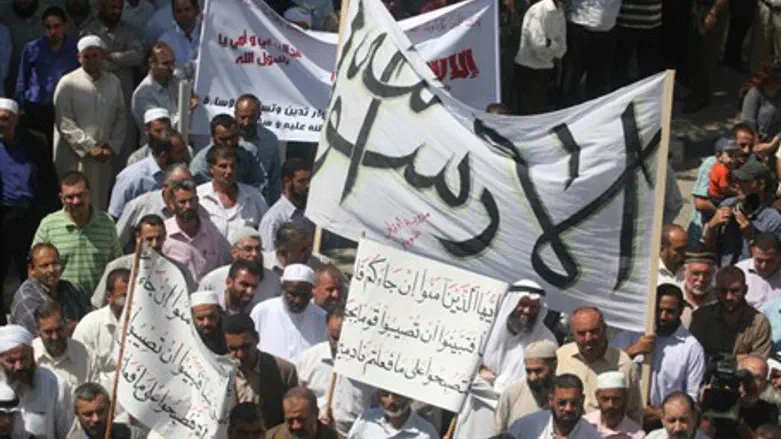 Illustrative: signs and pickets in Arabic