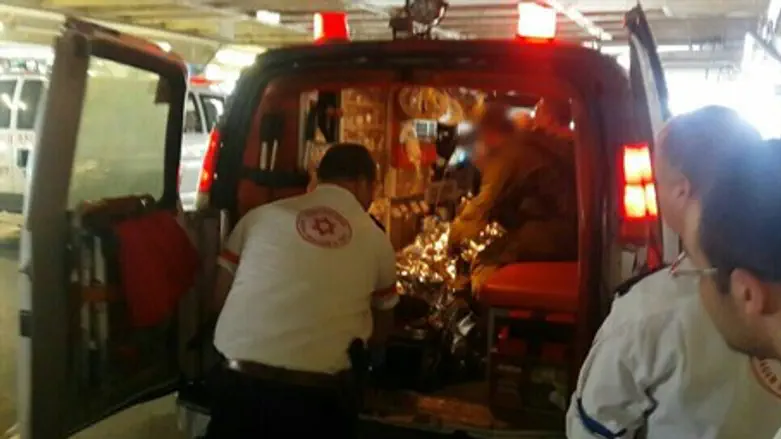 Injured victim at entrance to Shaarei Tzedek