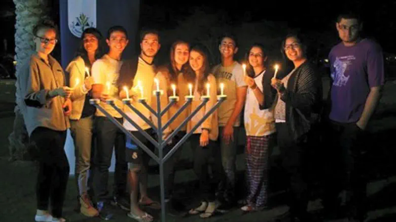 IDF orphans light Hanukkah candles