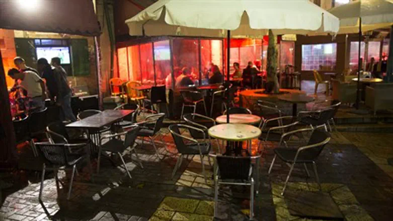 Empty tables outside Jerusalem pub