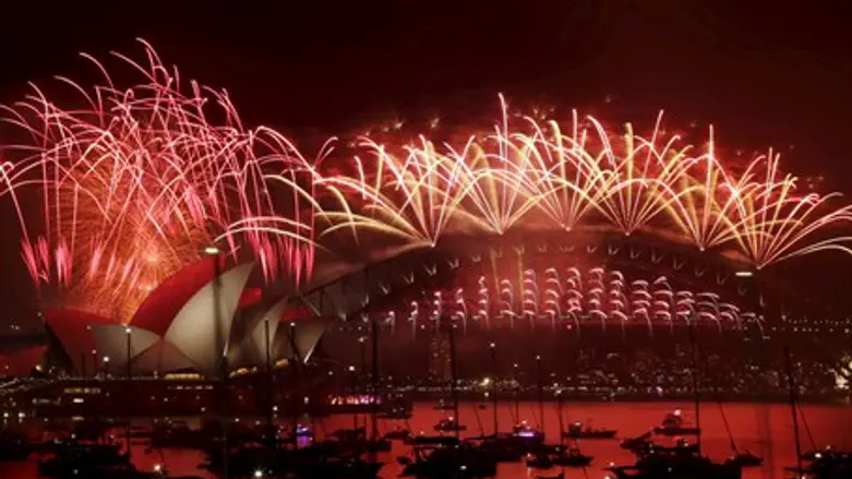 Fireworks explode over the Sydney Opera House and Harbour Bridge