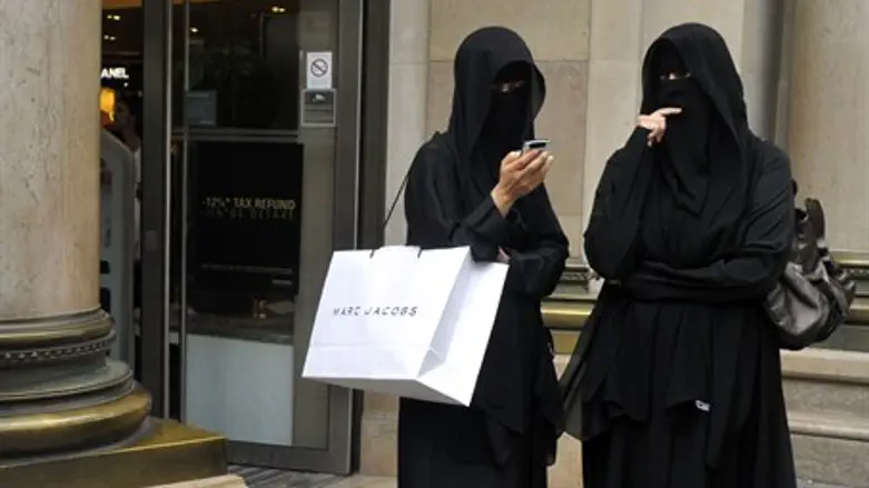 Muslim women in burqa face veils (illustration)