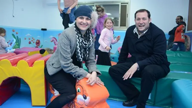Adva Biton and Yossi Dagan at play area in memory of Adelle Biton